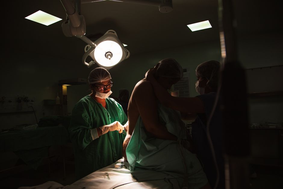 Surgical team performing breast conserving surgery lumpectomy in a Korean hospital operating room