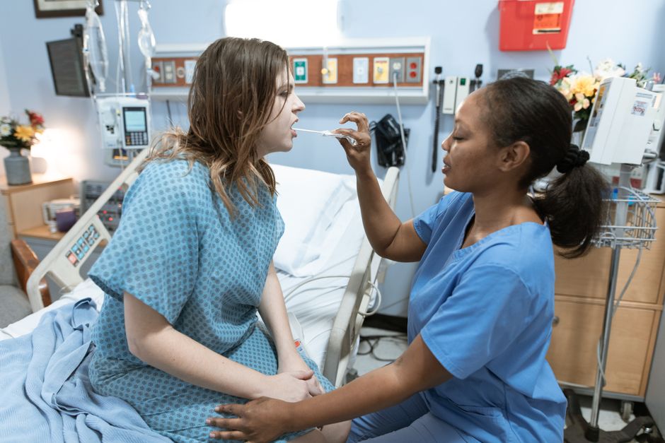 Patient performing incentive spirometry breathing exercises during bronchoplasty recovery in Korean hospital