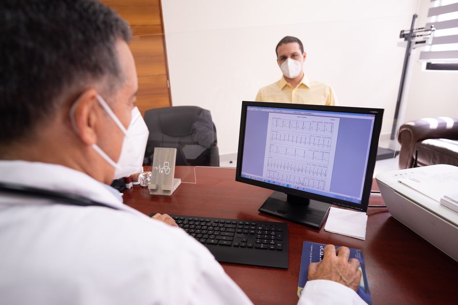 Cardiologist reviewing ECG results with a patient at a Korean hospital