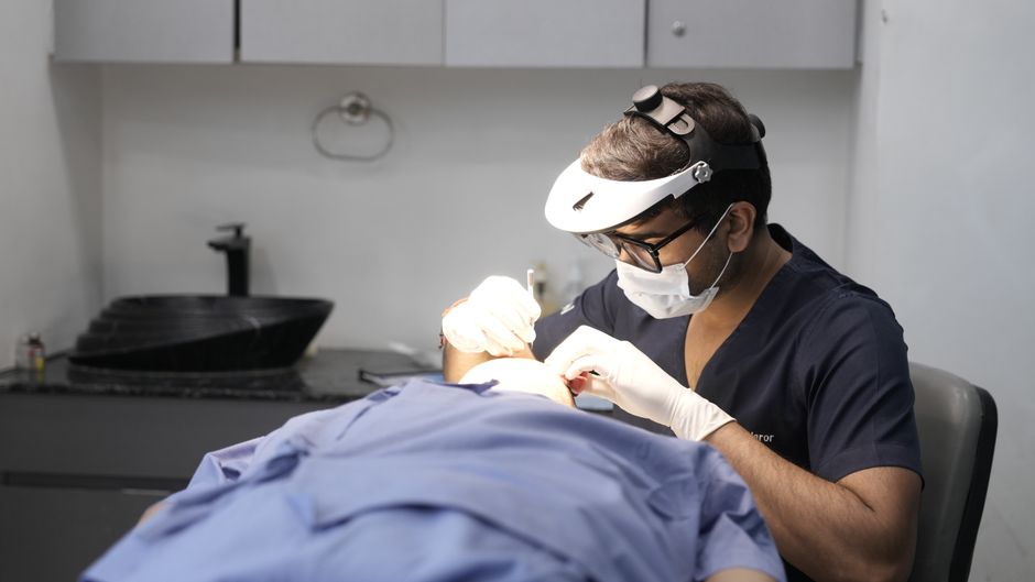 Dermatologist assessing a patient's skin before a chemical peel at a Seoul clinic in South Korea
