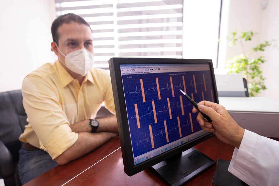 Cardiac surgeon consulting with a patient before coronary bypass surgery at a Seoul hospital