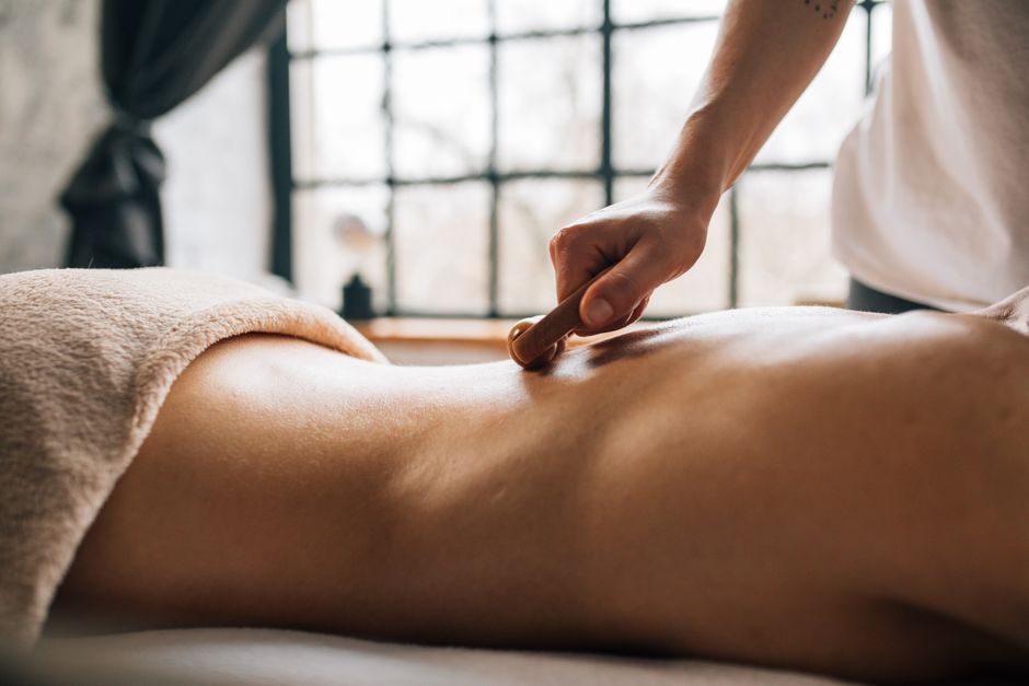 Patient resting after cupping therapy in Korea with temporary circular skin marks fading during recovery