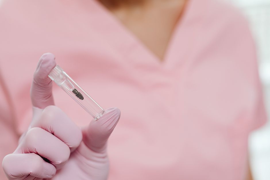 Close-up of titanium dental implant post placement procedure in Korea dental clinic