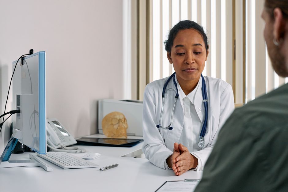 Colorectal surgeon consulting with a patient before hemorrhoid surgery at a clinic in Korea