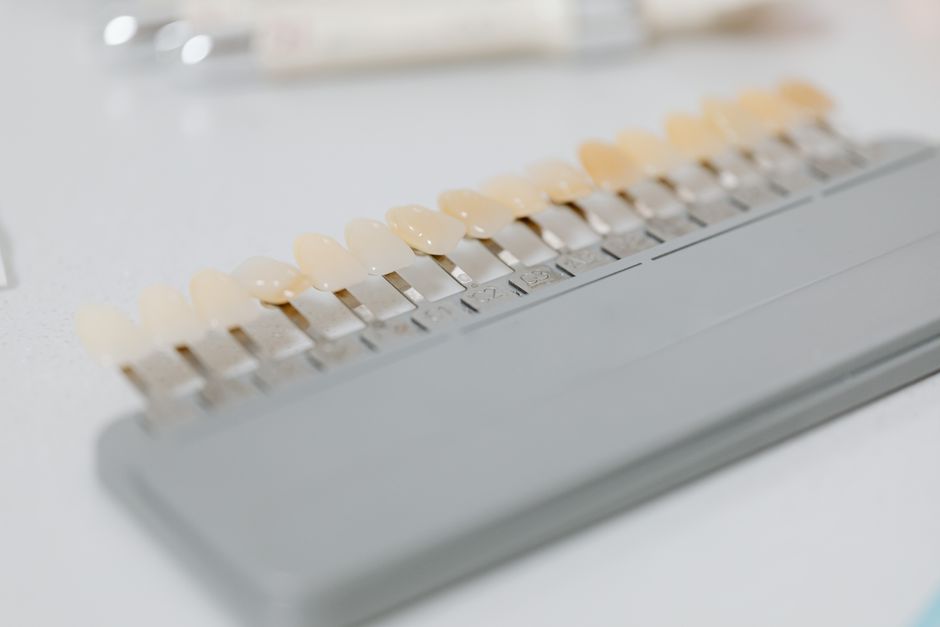Dental technician milling a zirconia crown using CAD/CAM equipment in a Korean dental laboratory