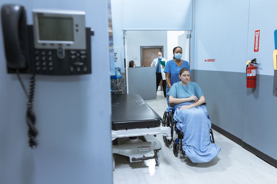 Patient practising walking on parallel bars during inpatient rehabilitation in Korea