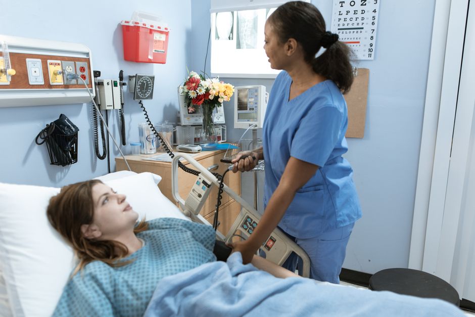 Kidney transplant patient in early recovery walking with nurse at Korean hospital