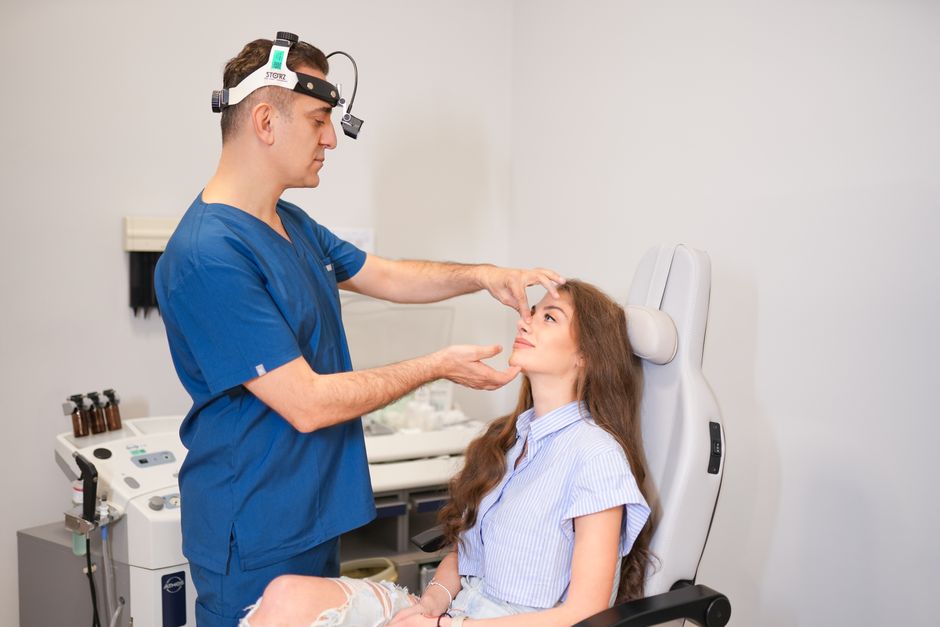 Plastic surgeon planning V-line contouring with a patient in Korea